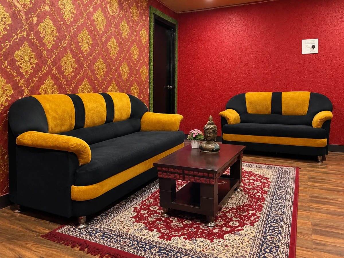 Black and yellow reception sofas with red and gold wallpaper at Aroma